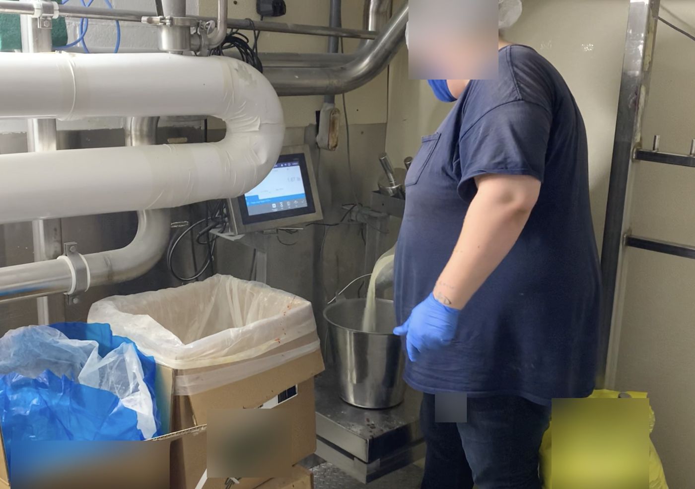 An operator weighing ingredients on Form+ at a beverage plant